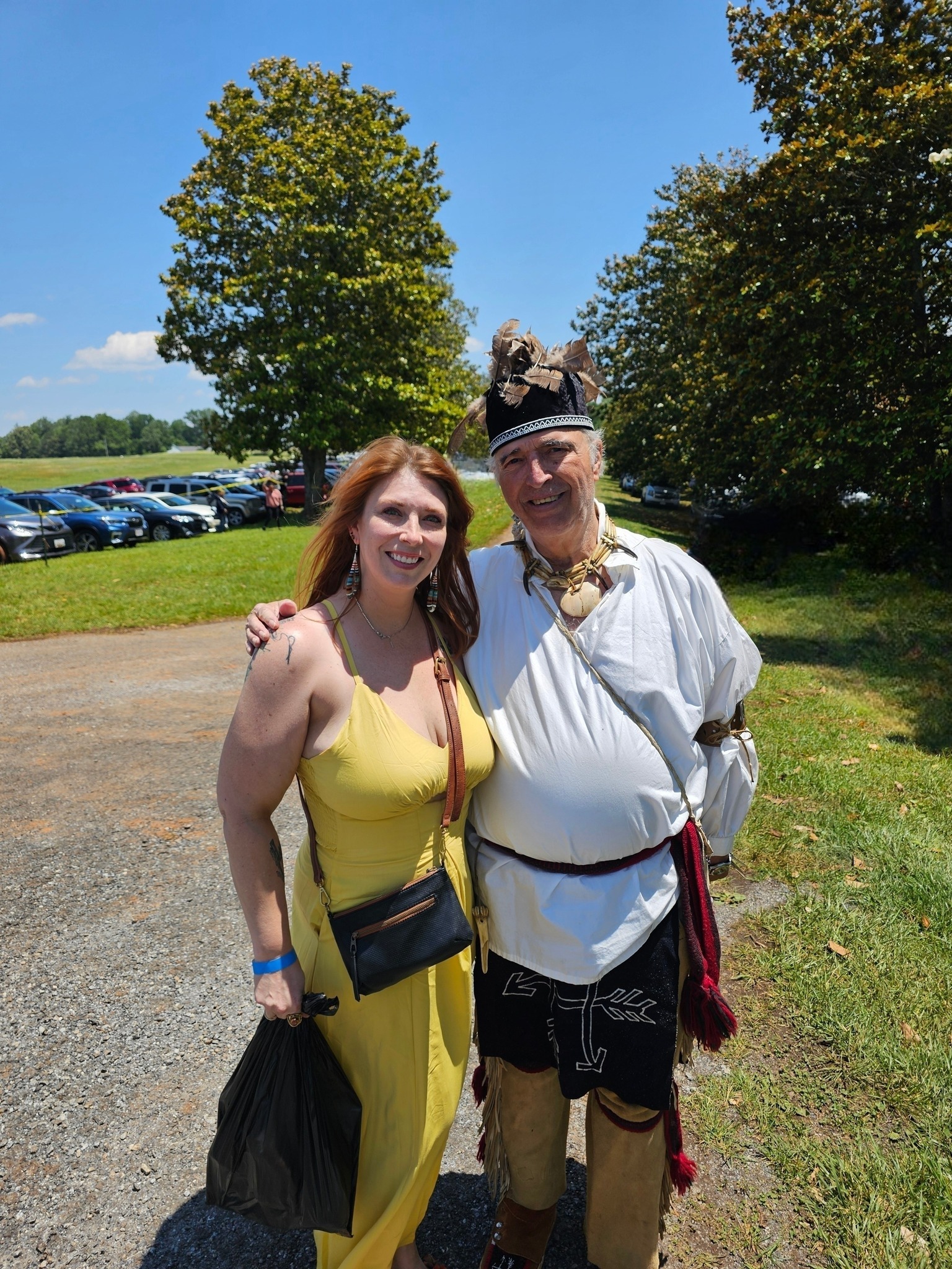 Sarah in a yellow sun dress outside